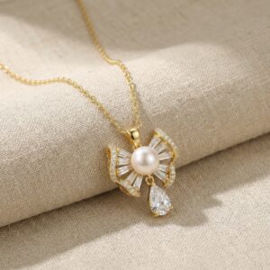925 Sterling Silver Elegant Bow Ribbon Pearl Pendant with Shimmering Accents and Teardrop Drop