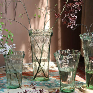 Wavy-mouth Glass Vase With And Lilies Arranged As An Floral Display