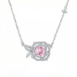 Silver necklace with a pink gemstone in the center, set in a diamond-encrusted rose pendant.
