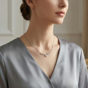 925 Sterling Silver Elegant Sterling Silver Antler Necklace with Pale Green Teardrop Gemstone and Pave Accents.