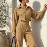 This New Women's Fashionable And Casual Two-piece Set Features A Long-sleeved, Collared, Cropped Top With A Zipper And Elasticated Waist, Paired With Loose-fitting Pants. The Comfortable Design Is Per